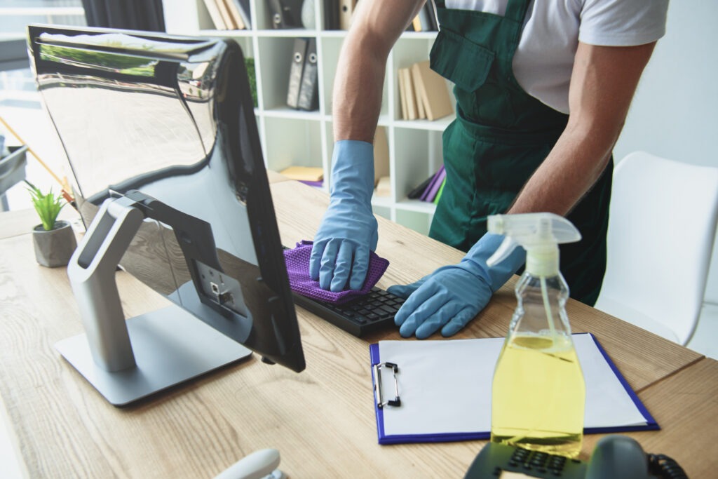 Someone with rubber gloves doing Office Cleaning in North London